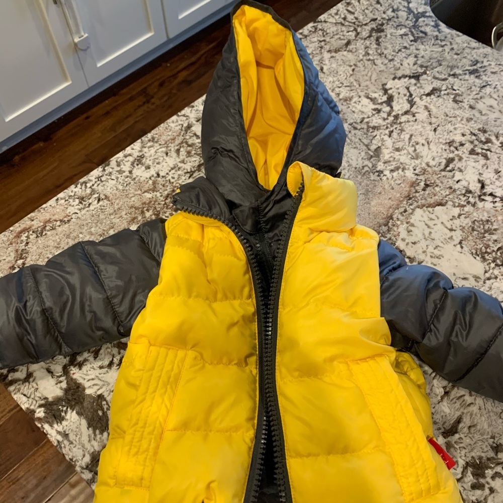 Yellow winter jacket 12 months. Car seat safe!